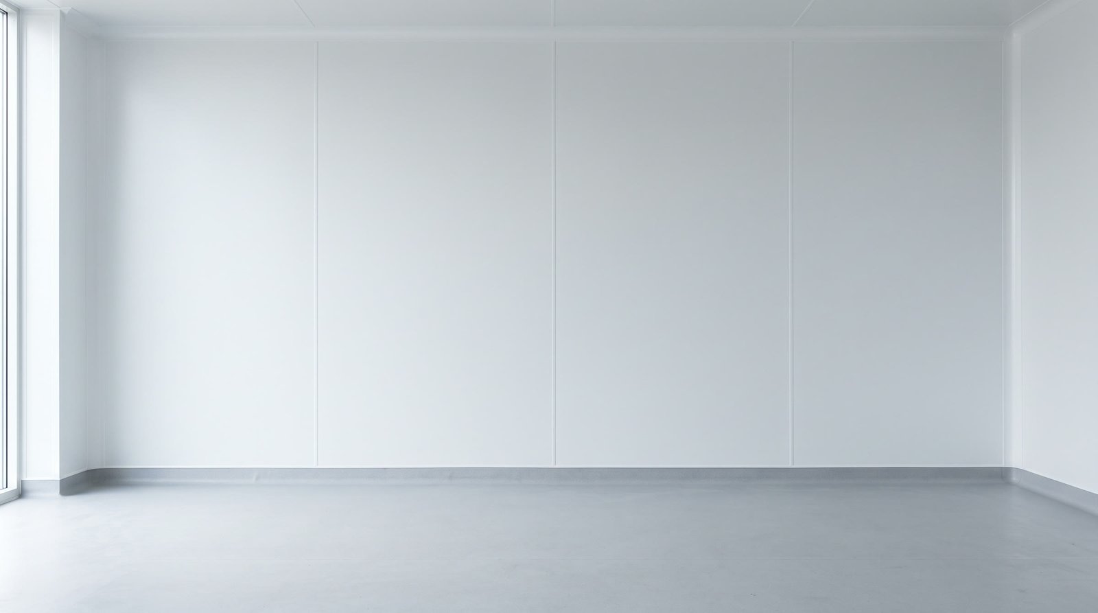 The same room finished: hygienic wall cladding with flush welded joints and a coved vinyl floor.